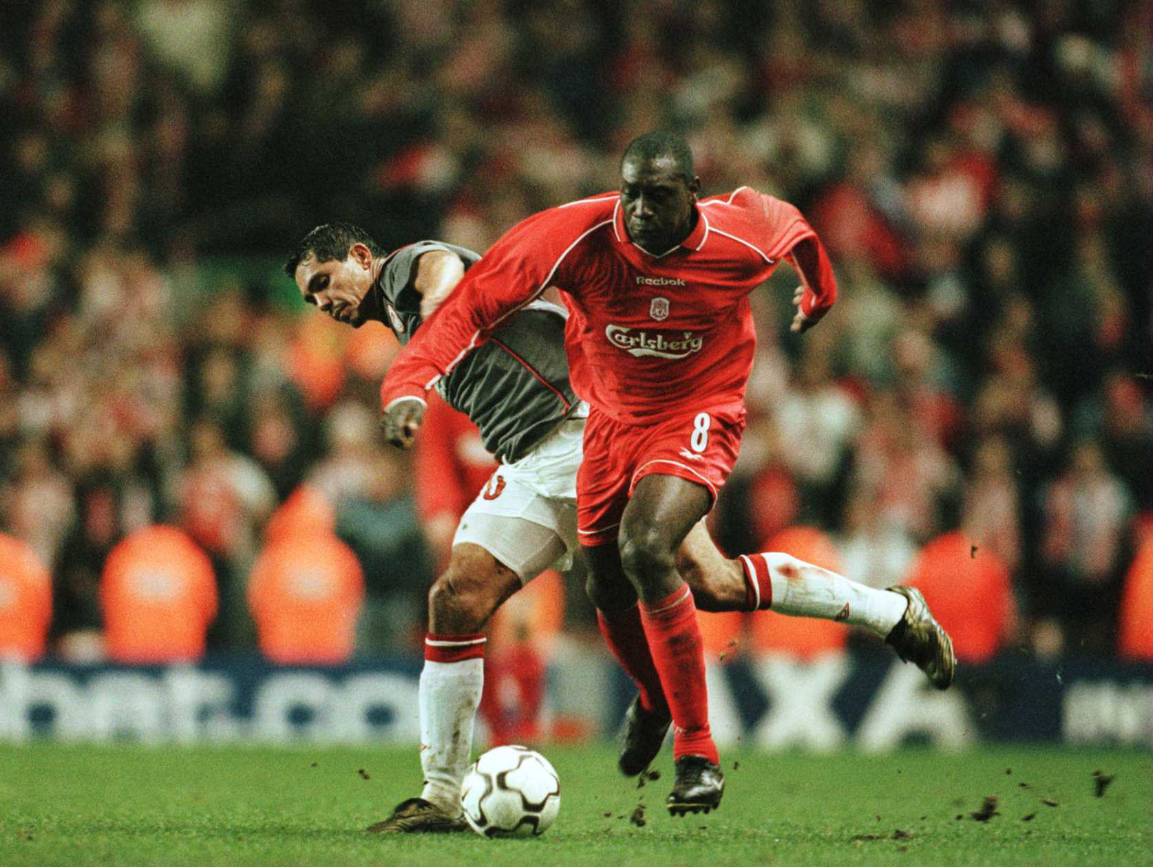 7 Dec 2000:  Emile Heskey of Liverpool Alexios Alexandris of Olmpiakos during the Liverpool v Olympiakos UEFA Cup Third Round, Second Leg match at ...